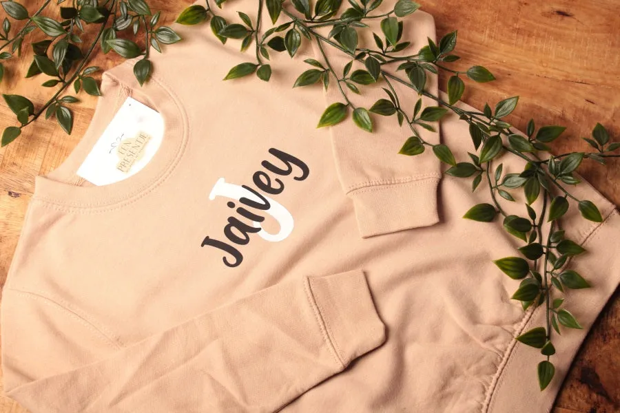 Een presentje Trui initiaal en naam creme 1-2 jaar